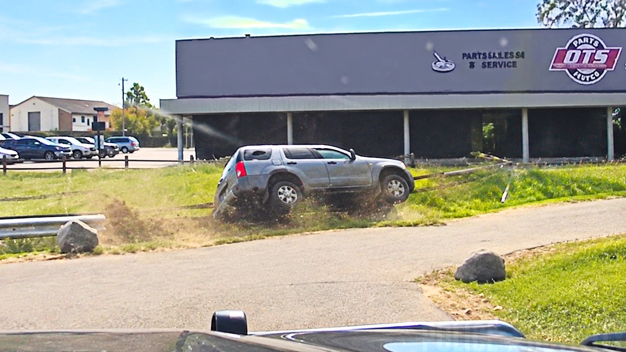 Suspect Rams Police SUV Then Ends Up Flipping Into a Pond